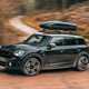 MINI Countryman (2023) review: front three quarter cornering, off-road driving, black paint