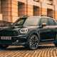 MINI Countryman (2023) review: front three quarter static, black paint, building in background