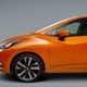 Nissan Micra, orange, side 