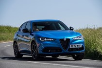 Alfa Romeo Stelvio review - 2023 facelift, front view, blue, driving round corner