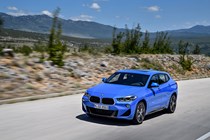 BMW 2018 X2 (lhd) in blue front three-quarters driving/action