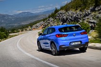 BMW 2018 X2 (lhd) in blue rear three-quarters driving/action