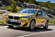 BMW 2018 X2 (lhd) in yellow/gold front three-quarters driving/action