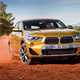 BMW 2018 X2 (lhd) in yellow/gold front three-quarters driving/action