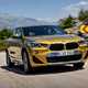 BMW 2018 X2 (lhd) in yellow/gold front three-quarters driving/action