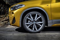 BMW 2018 X2 in yellow/gold exterior detail - front wheel