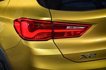 BMW 2018 X2 in yellow/gold exterior detail - rear light cluster