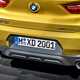 BMW 2018 X2 in yellow/gold exterior detail - rear bumper and exhausts