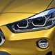 BMW 2018 X2 in yellow/gold exterior detail - front light cluster