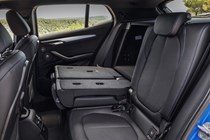 BMW 2018 X2 in blue - interior detail rear passenger seats lowered