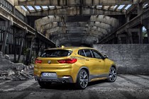 BMW 2018 X2 in yellow/gold - static exterior - rear three-quarters