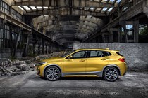 BMW 2018 X2 in yellow/gold - static exterior - looking side-on
