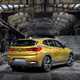 BMW 2018 X2 in yellow/gold - static exterior - rear three-quarters