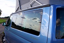 VW California review - 2016 model, Ocean sticker close up with clouds reflecting in side glass