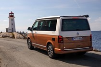 VW California review - 2019 T6.1 model, rear view parked near lighthouse, two-tone paint