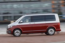 VW Caravelle review - T6.1 facelift, 2019, red and silver, left side view, driving