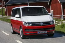 2016 VW Caravelle driving, front view, Generation Six model, red and white