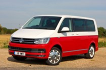 VW Caravelle T6, Generation Six, red and white, front view