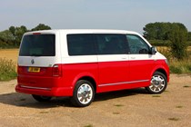 VW Caravelle T6, Generation Six, red and white, rear view