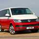 VW Caravelle T6, Generation Six, red and white, front view, close up