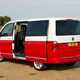 VW Caravelle T6, Generation Six, red and white, rear view, side door open