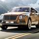 Bentley Bentayga review - 2016 model, front view, driving, gold