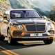 Bentley Bentayga review - 2016 model, front view, driving on road, gold