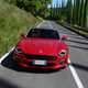 Fiat 124 Spider red driving front