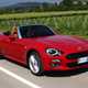 Fiat 124 Spider red driving front side