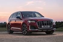 Audi SQ7 review (2022) - front three quarter static, red car, dusk lighting
