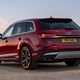 Audi SQ7 review (2022) -rear three quarter static, red car, dusk lighting