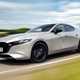 Mazda 3 (2023) review: front three quarter driving, silver paint, country lane