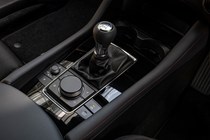 Mazda 3 (2023) review: manual gear shifter, black upholstery
