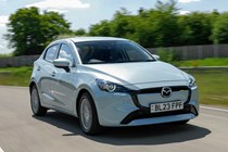 Mazda 2 (2023) review: front three quarter driving, blue paint, British country road