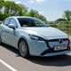Mazda 2 (2023) review: front three quarter tracking cornering, blue paint, British country road