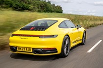 Porsche 911 review (992) - Carrera T, yellow, rear, driving