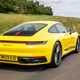 Porsche 911 review (992) - Carrera T, yellow, rear, driving
