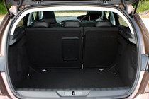 Peugeot 308 Hatchback (2014-) UK rhd model in metallic brown. Boot and load space