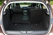 Peugeot 308 Hatchback (2014-) UK rhd model in metallic brown. Boot and load space left hand seat down