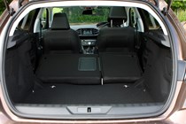 Peugeot 308 Hatchback (2014-) UK rhd model in metallic brown. Boot and load space lboth seats down