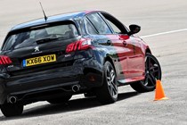 Peugeot 308 Hatchback (2014-) UK rhd GTi model. Driving/action around the cones. Rear three-quarters