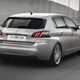 Peugeot 308 Hatchback (2014-) French lhd model in metallic silver. Driving/action from the rear