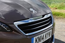Peugeot 308 Hatchback (2014-) UK rhd model in metallic copper. Exterior detail - front grille and number plate