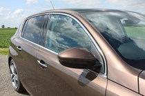 Peugeot 308 Hatchback (2014-) UK rhd model in metallic copper. Exterior detail - side profile, wing mirror and glass