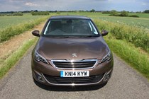 Peugeot 308 Hatchback (2014-) UK rhd model in metallic copper. Exterior detail - front showing headlamps, grille and number plate