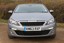 Peugeot 308 Hatchback (2014-) UK rhd model in metallic silver. Exterior detail - front view of headlamps, grille and number plate