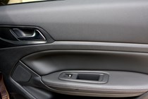 Peugeot 308 Hatchback (2014-) UK rhd model in metallic copper. Interior detail, right-hand inner door panel