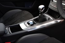 Peugeot 308 Hatchback (2014-) UK rhd model in metallic copper. Interior detail,  center console and gearshift