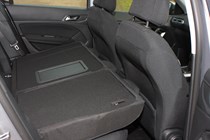 Peugeot 308 Hatchback (2014-) UK rhd model in metallic silver. Interior detail, rear passenger seats lowered