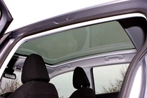 Peugeot 308 Hatchback (2014-) UK rhd model in metallic silver. Interior detail, panoramic sunroof